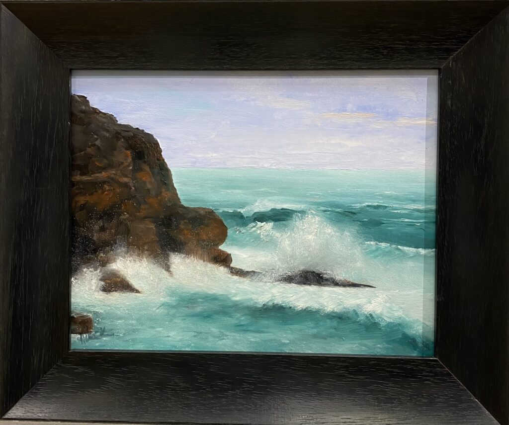 Painting of waves crashing against a rocky cliff by Henry Leck, framed in black.