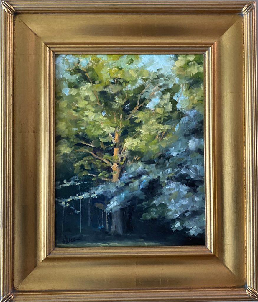 Framed oil painting titled 'Light on the Beech' by Henry Leck, featuring a sunlit beech tree surrounded by lush greenery in an impressionistic style.