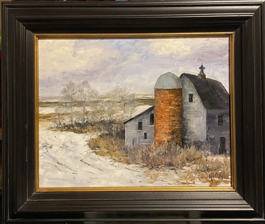 Framed oil painting titled 'Winter Barn' by Henry Leck, depicting a rustic barn and silo in a serene snow-covered rural landscape.