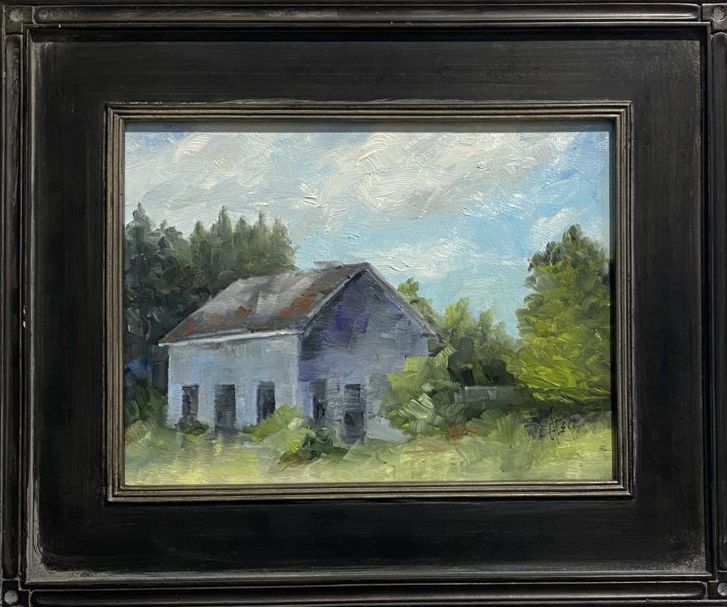 Framed oil painting titled 'Old Homeplace' by Henry Leck, depicting an aged rustic farmhouse with a weathered roof, surrounded by lush greenery under a soft blue sky.