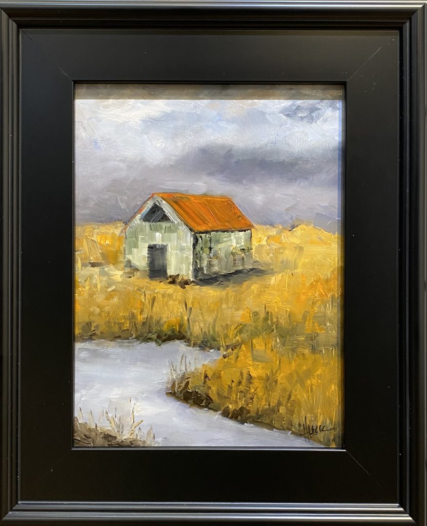 Framed oil painting titled 'There's a Storm a Comin'' by Henry Leck, depicting a rustic barn with a red roof in a golden field under a dark stormy sky.