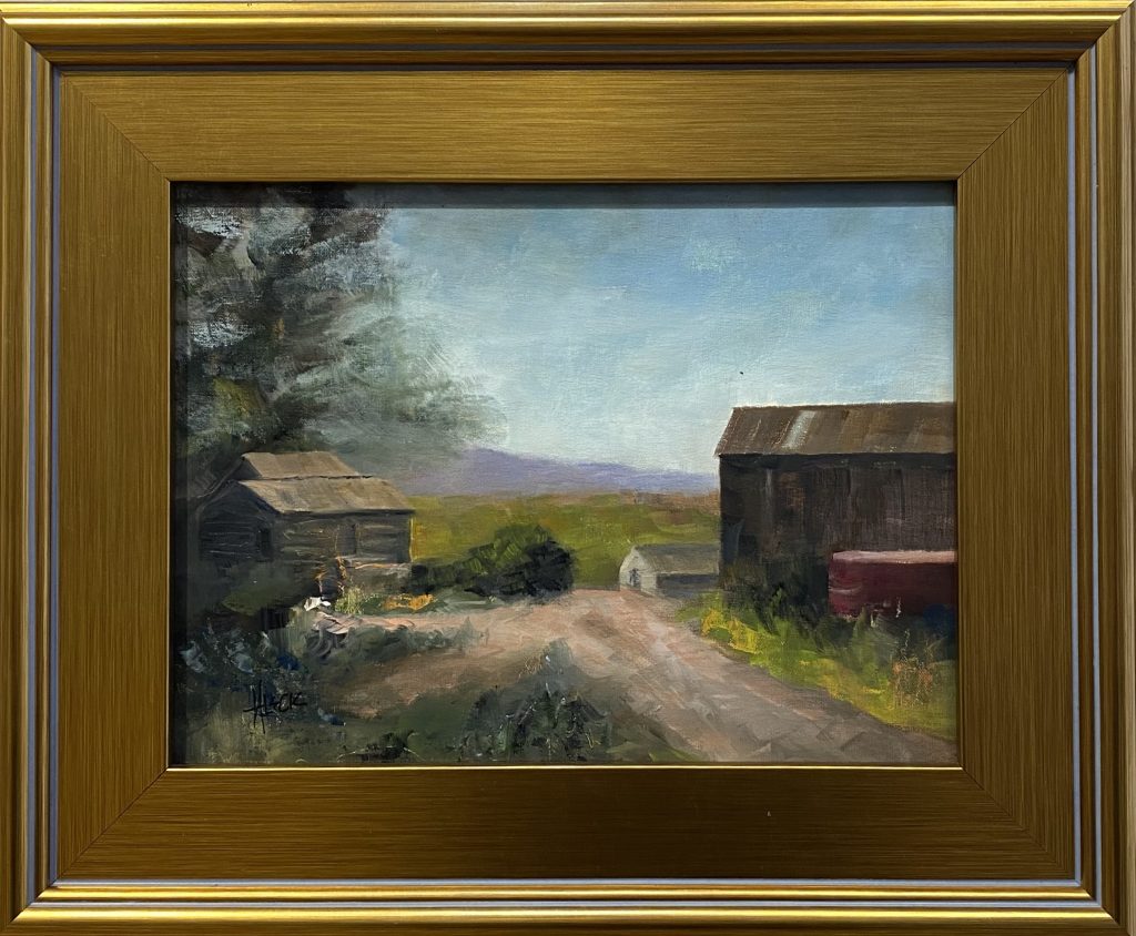 A rustic farm scene featuring weathered barns and a dirt path leading into the countryside, with distant mountains in the background.