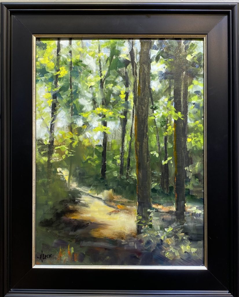 Framed oil painting titled 'Sweetwater Trail' by Henry Leck, depicting a sunlit forest trail winding through lush green trees with dappled light filtering through the canopy.