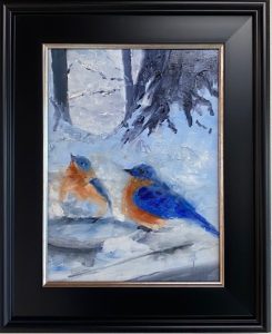 Framed landscape painting of two vibrant bluebirds with orange chests perched in a snowy winter forest scene