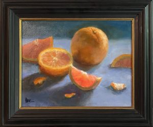 Still life painting of whole and sliced oranges with glowing pinkish-orange pulp on a cool-toned surface