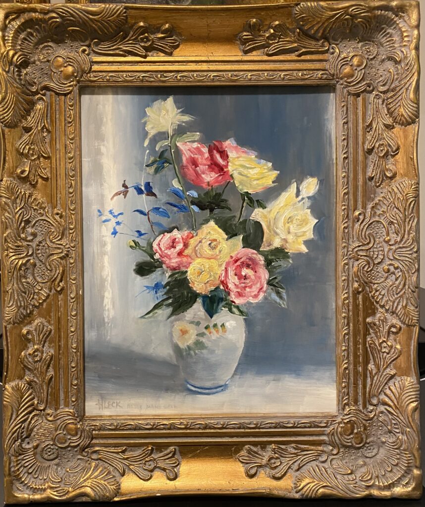 Framed still life painting of roses in various colors, including pink, yellow, and white, arranged in a white vase with subtle blue background, painted by Henry Leck in the style of Marie Goth.